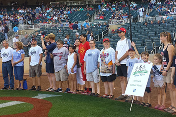 Kids receiving awards at a Twins game